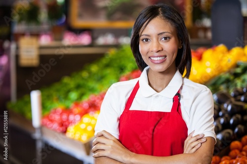 staff standing with arms crossed in organic section photo