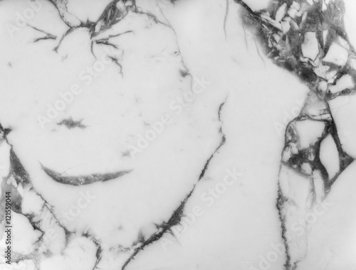 Surface of natural mineral howlite, picture in the stone resembles a human face. photo