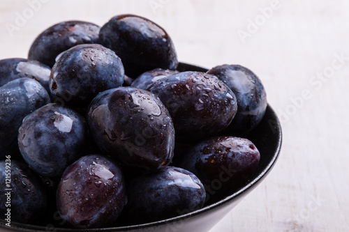 Wallpaper Mural fresh plums in black bowl Torontodigital.ca