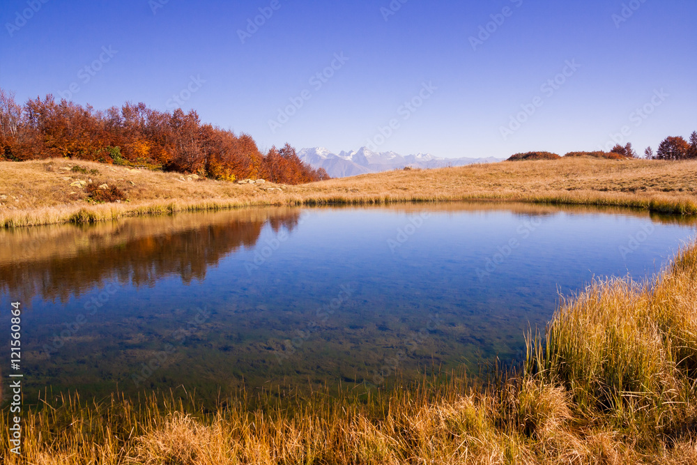 beautiful Caucasian mountains and lake in autumn season