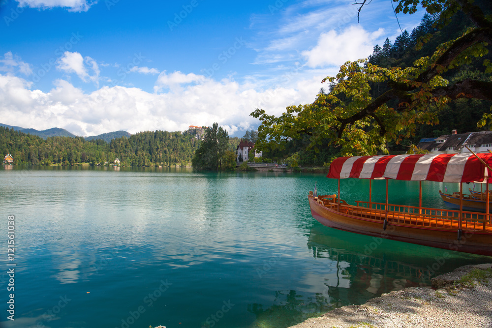 Naklejka premium Boats at the pier of the Bled Island, Slovenia.