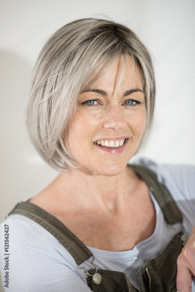 a portrait of a nice woman retired who wears a overalls to paint a portrait of a nice woman retired who wears a overalls to paint
