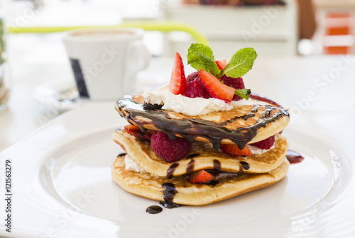 Pancakes with raspberries and strawberries