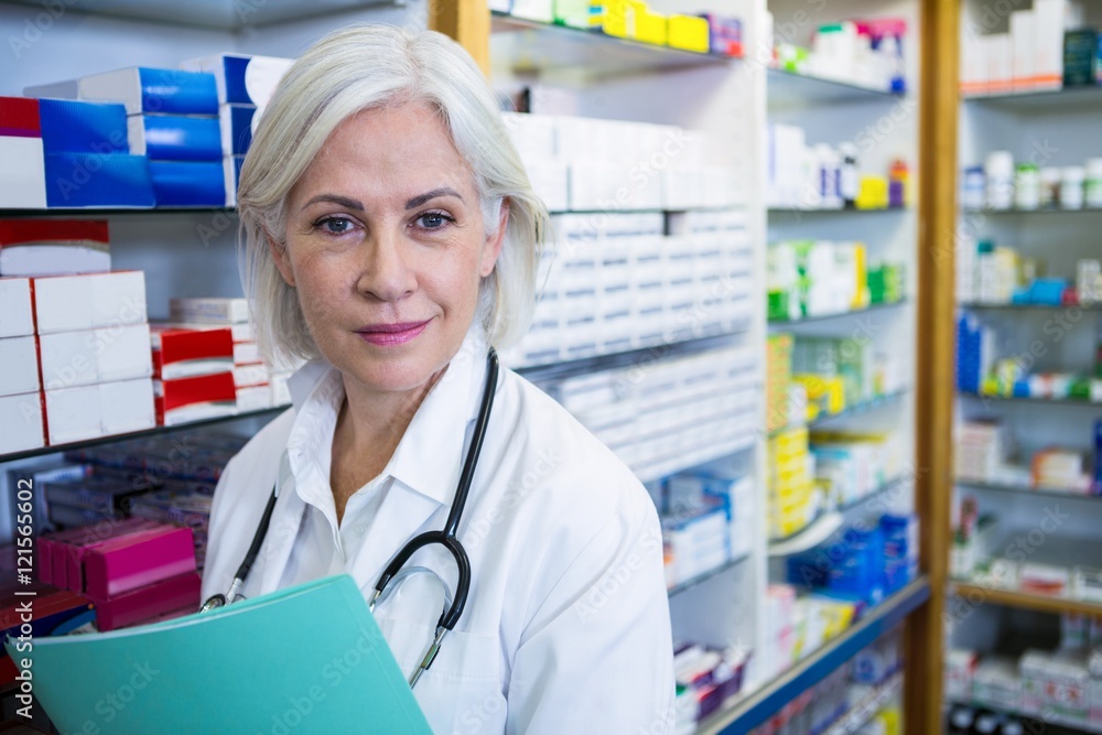 Pharmacist holding a file Pharmacist holding a file