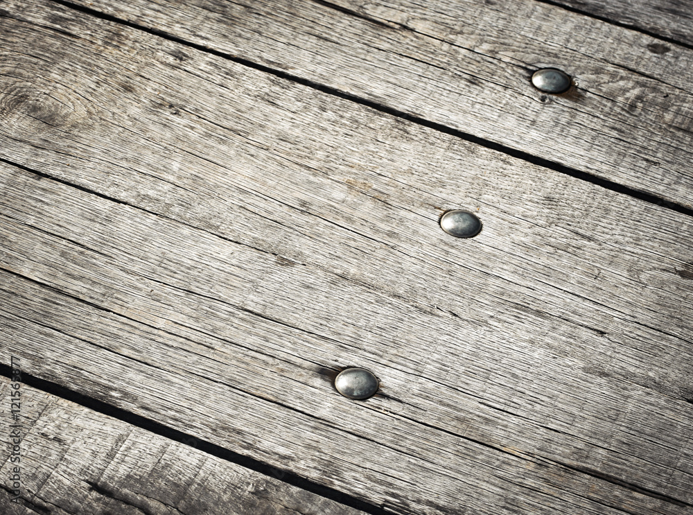 Obraz premium riveted on wooden boards