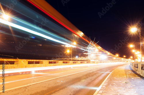 Ancient town of Nesebar UNESCO - protected. Road  night lights  windmill. Car light trails. Long exposure photo taken