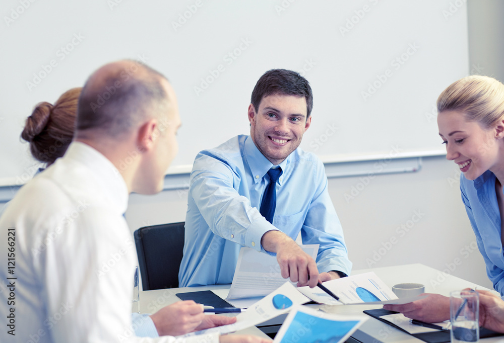 business people with papers meeting in office business people with papers meeting in office