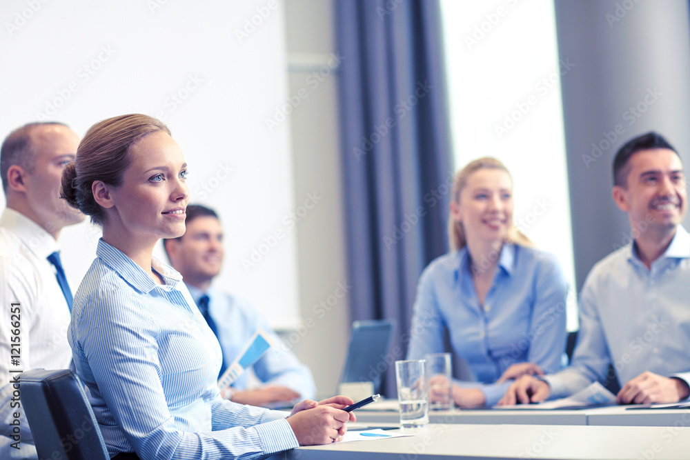 group of smiling businesspeople meeting in office group of smiling businesspeople meeting in office