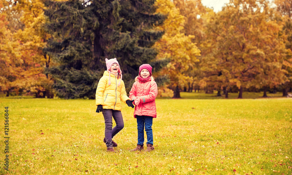 Fototapeta premium two happy little girls in autumn park