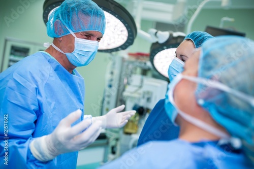 Surgeons interacting with each other in operation room