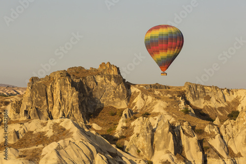 Hot air balloon flying over rock landscape at Cappadocia Turkey © danmir12