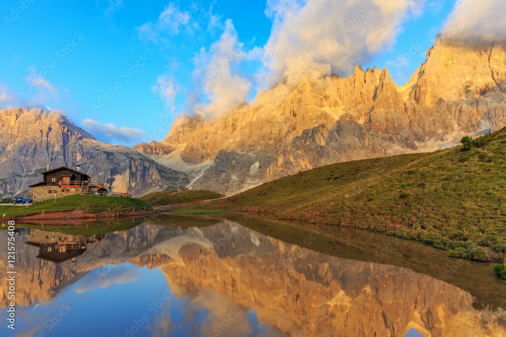 Sunset near Passo Rolle in the Dolomites Alps 