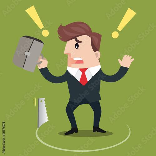 businessman standing while sawing the ground on green background