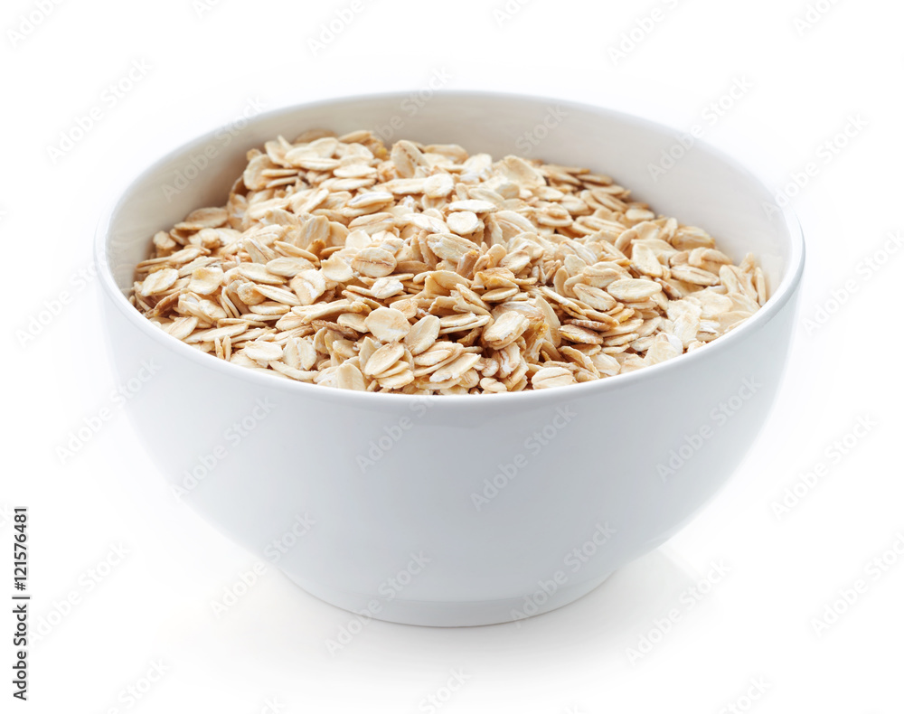 Bowl of oat flakes isolated on white Bowl of oat flakes isolated on white