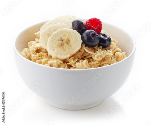 Bowl of healthy oatmeal isolated on white