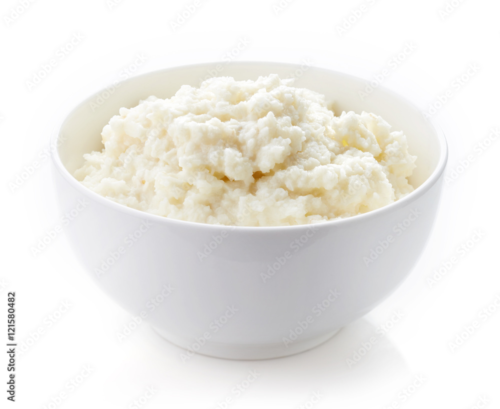 Bowl of rice flakes porridge isolated on white Bowl of rice flakes porridge isolated on white