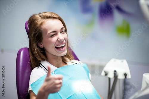 Konstfotografi Dentist curing a woman patient in the dental office in a pleasant environment
