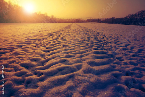 Winter snowy landscape at sunset.