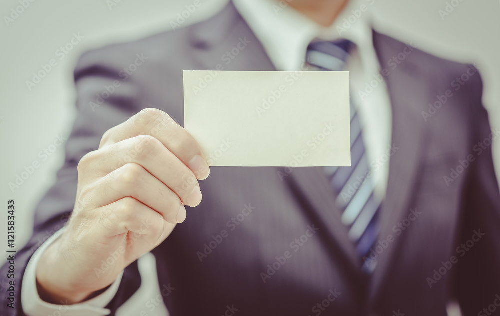 Man's hand showing business card - closeup sho , vintage Man's hand showing business card - closeup sho , vintage
