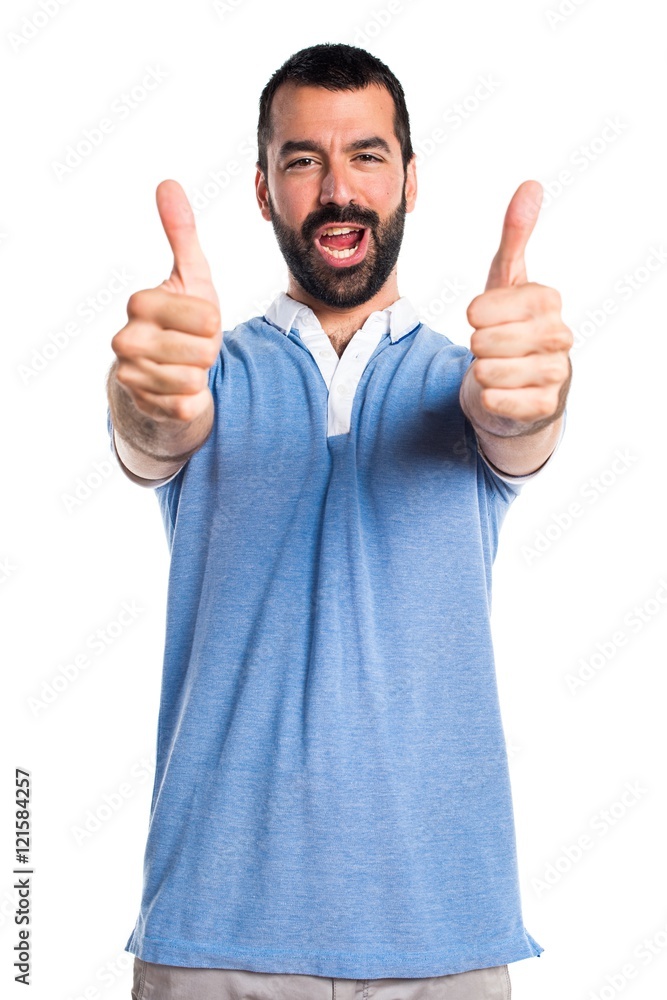Man with blue shirt with thumb up Man with blue shirt with thumb up