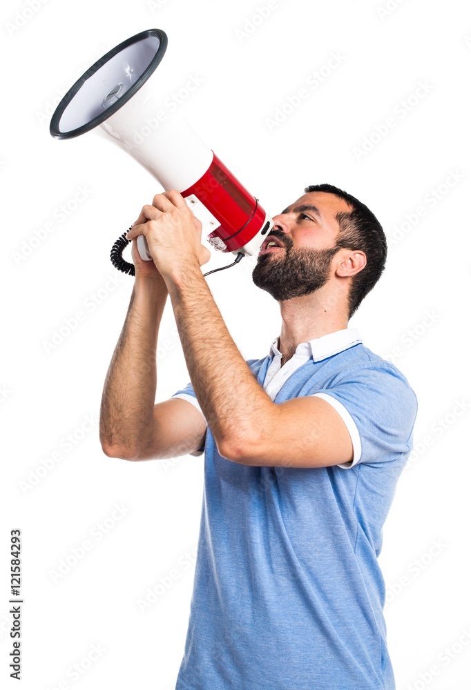 Man with blue shirt shouting by megaphone Man with blue shirt shouting by megaphone