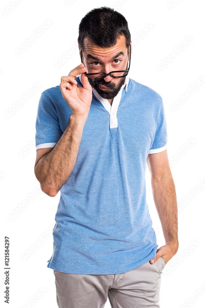 Man with blue shirt showing something Man with blue shirt showing something