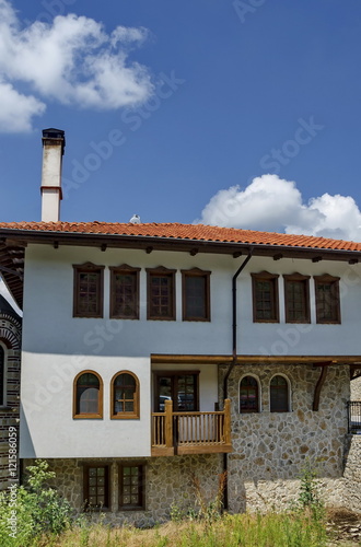 Part of exterior monastic house in restored Montenegrin or Giginski monastery St. St. Cosmas and Damian, mountain Kitka, Breznik, Pernik region, Bulgaria 