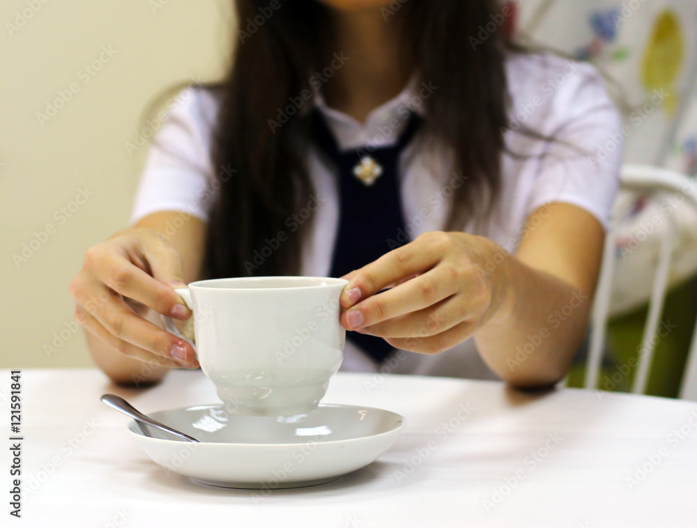 The girl is holding morning coffee, women's hands. The girl is holding morning coffee, women's hands.