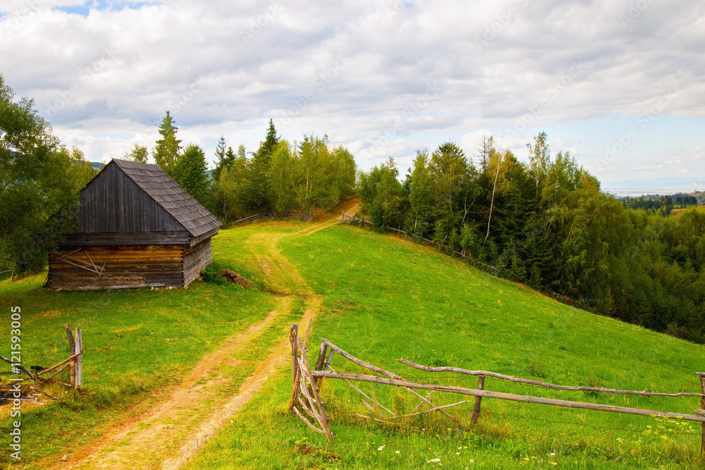 Pasture and barn at the edge of the forest Pasture and barn at the edge of the forest