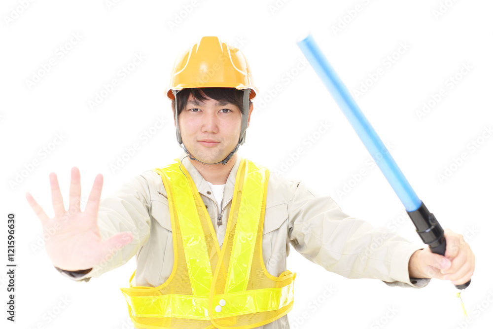 誘導灯を持つ労働者