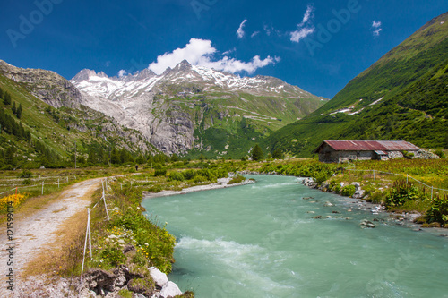 Fototapeta Naklejka Na Ścianę i Meble -  Swiss Alps valley near Gletch with Furka pass mountain road, Switzerland
