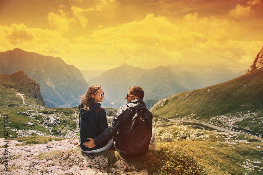 Fototapeta premium Couple of travelers on top of a mountain. Mangart, Julian Alps, National Park, Slovenia