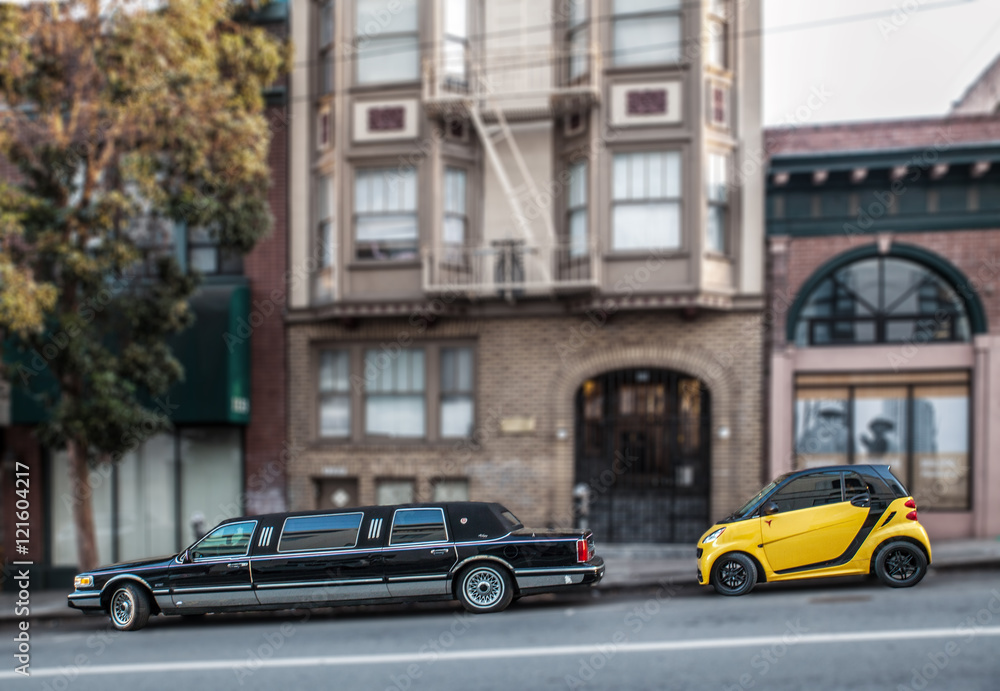 Limousine and mini in the street of San Francisco: symbol of inequality in the city