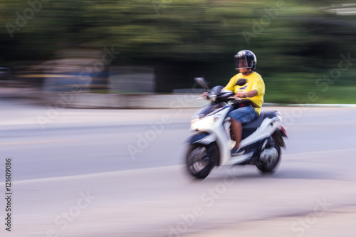 motorcycle panning in road  Asia