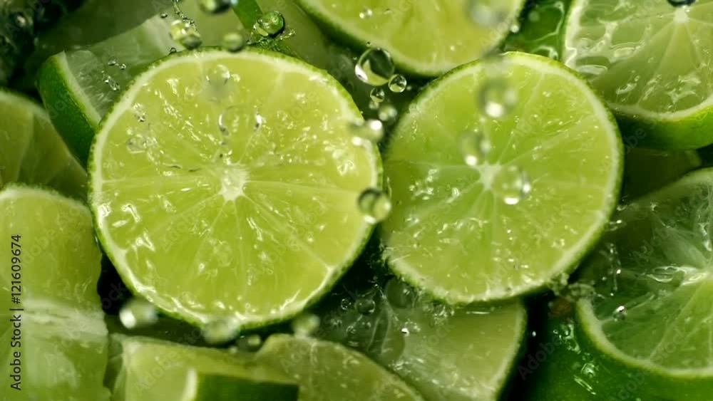 Limes Cut with Water Drops Super Slow Motion