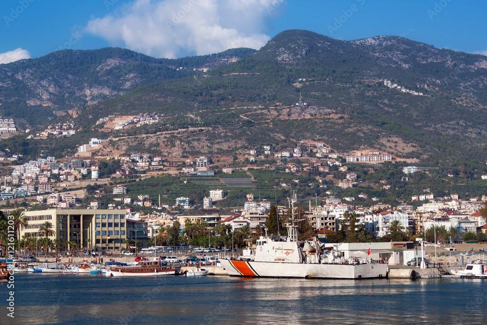 Coast of the Alanya with moored ships and boats. Alanya is a popular resort on the Mediterranean Sea.