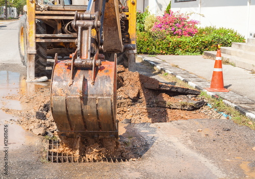 Excavator working on the Repair