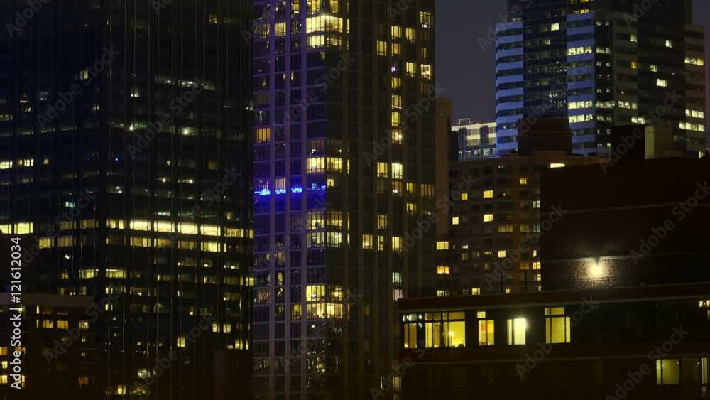 Office and Residential Buildings Windows Turn On and Off Time lapse Tilt Up 4k Office and Residential Buildings Windows Turn On and Off Time lapse Tilt Up 4k