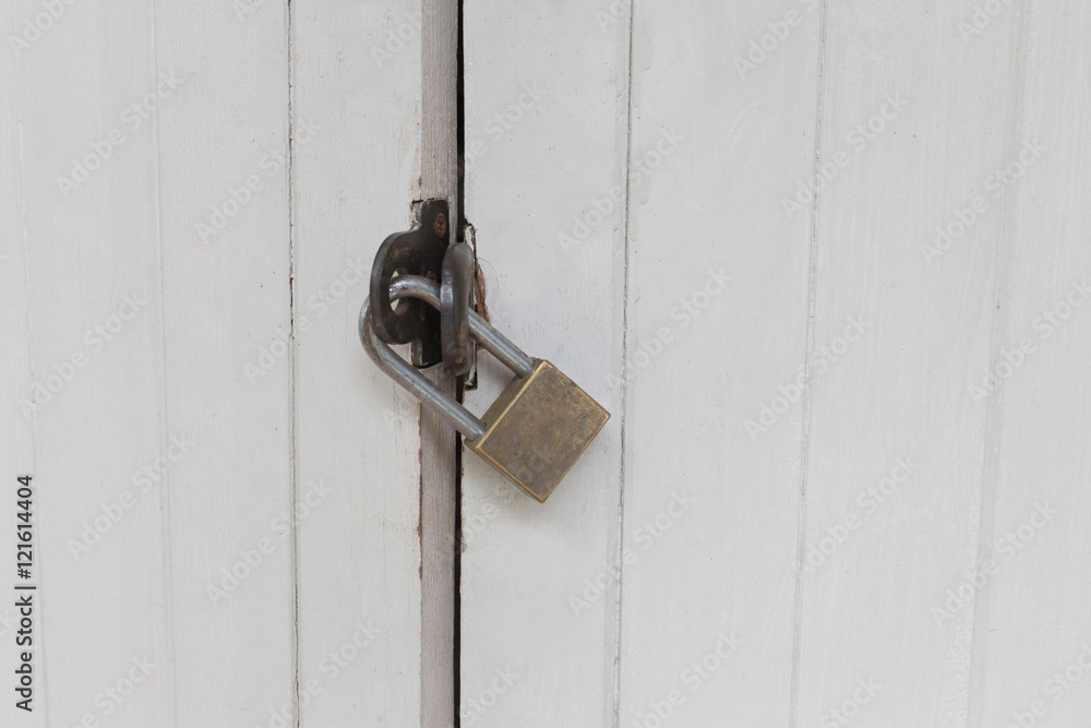 Old padlock on a white wooden door , Old White retro Door with Padlock, locked door,door with master key