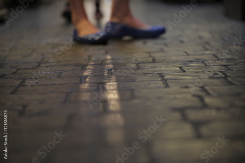 Fancy Woman's Shoes on Stone Floor