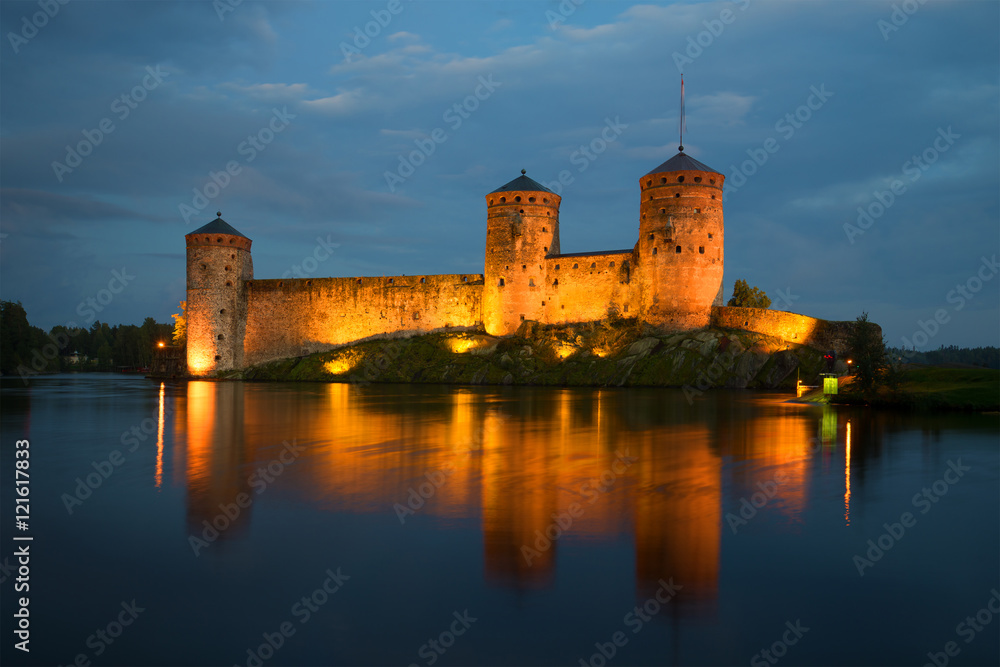 View of the towers of the Olavinlinna fortress in the August twilight. Savonlinna, Finland