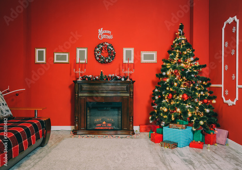 Defocused background Living room with christmas tree and fireplace