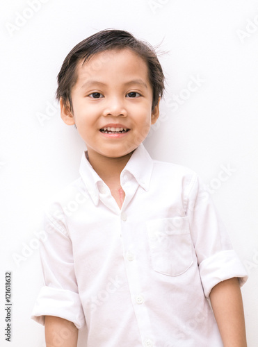 white shirt on little . smart asian boy