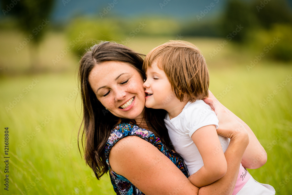 Mother and child hugging