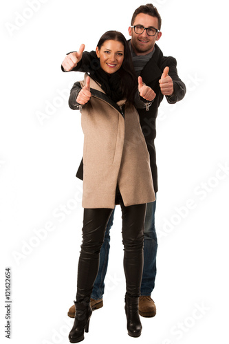 Business couple celebrating success holding fists and screaming