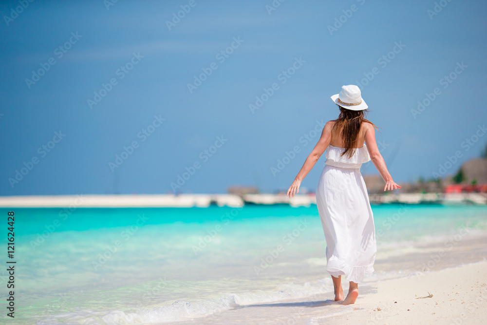 Young beautiful woman on beach vacation