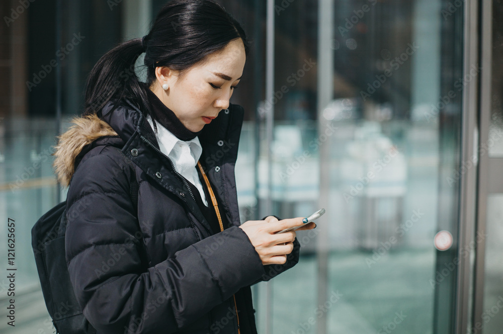 Asian woman using mobile phone Asian woman using mobile phone