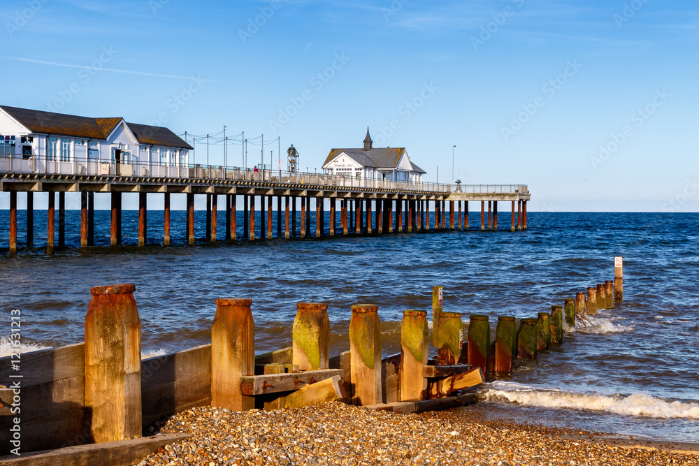 Obraz premium Wooden Groynes and Pier at Southwold Beach, UK