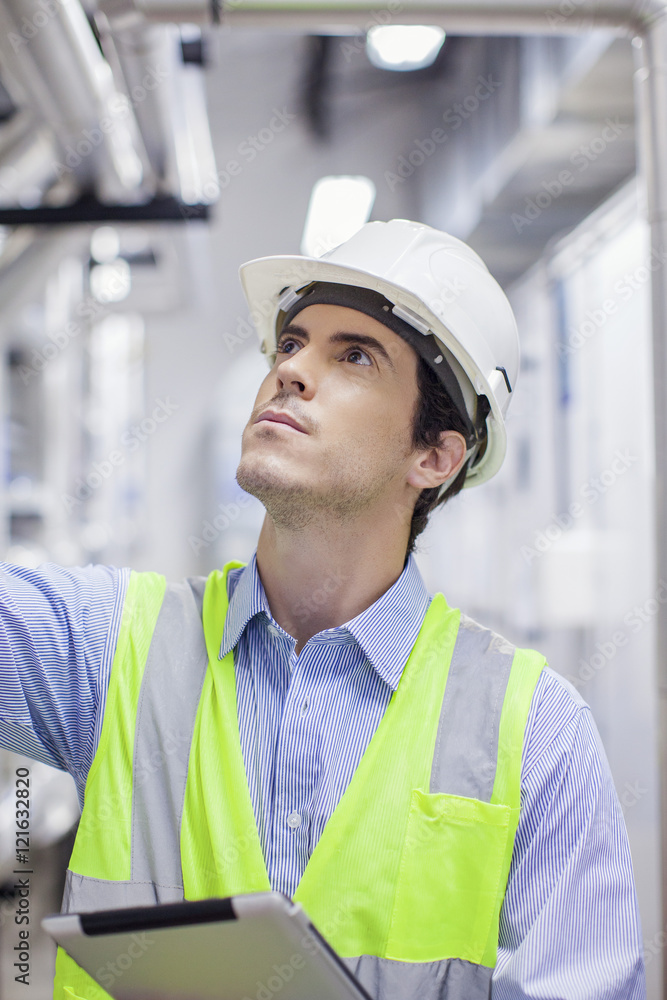 Technician inspecting industrial plant Technician inspecting industrial plant