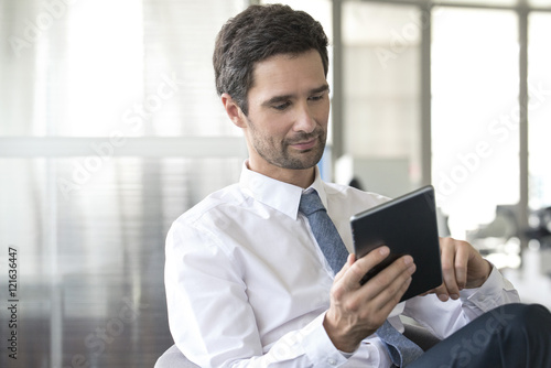 Businessman using digital tablet photo